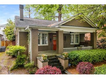 Charming brick home with a welcoming front porch and beautiful landscaping at 758 Argonne Ne Ave, Atlanta, GA 30308
