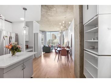 Bright condo featuring modern living space with open floor plan, city view and dining area at 860 Peachtree Ne St # 1103, Atlanta, GA 30308