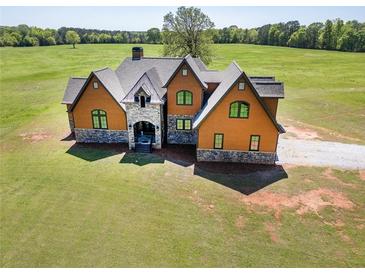 Stunning craftsman home featuring stone accents and expansive front yard at 5187 Parkview Rd, Social Circle, GA 30025