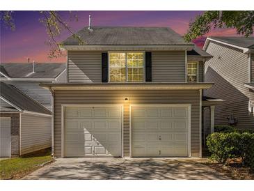 Charming home featuring a two-car garage and a welcoming exterior at 680 Barshay Dr, Covington, GA 30016