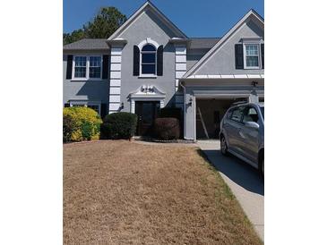 Charming two-story home with an attached two-car garage and manicured landscaping at 3657 Clearbrooke Ct, Duluth, GA 30097
