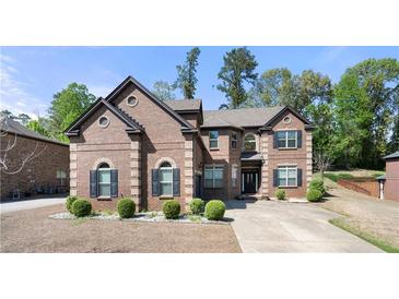 Charming brick home with manicured landscaping and symmetrical design elements, offering classic curb appeal and timeless elegance at 2745 Veltre Sw Ter, Atlanta, GA 30311