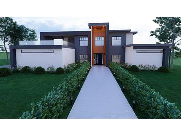 Modern home boasts a unique design with clean lines, well-manicured landscaping, and a welcoming entrance at 1068 Buckner Se Rd, Mableton, GA 30126