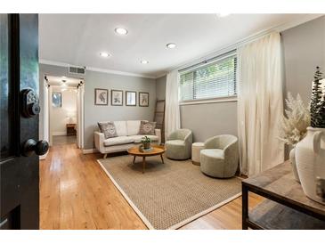 Bright living room featuring hardwood floors, modern furniture, and ample natural light at 880 Glendale Ne Ter # 9, Atlanta, GA 30308