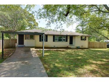 Charming single-story home with a carport and a well-maintained front yard at 4699 Ballew Dr, Powder Springs, GA 30127