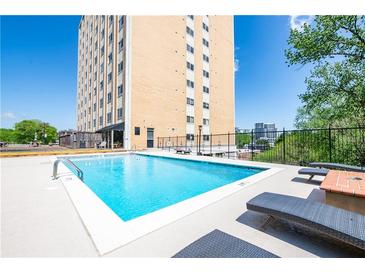 Outdoor pool with sun loungers offers a place to relax with city views on a sunny day at 2285 Peachtree Ne Rd # 604, Atlanta, GA 30309