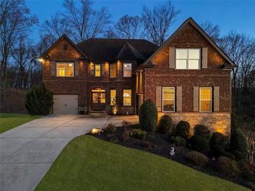 Charming two-story brick home with a manicured lawn and welcoming curb appeal at 4538 Sterling Pointe Nw Dr, Kennesaw, GA 30152