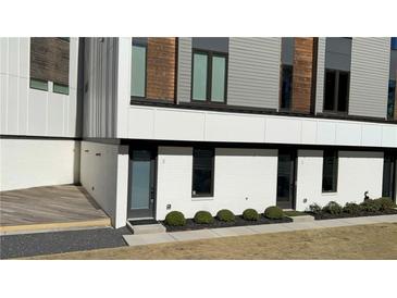 Modern townhome with painted brick and stylish gray and wood accents at 2424 Memorial Se Dr # 3, Atlanta, GA 30317