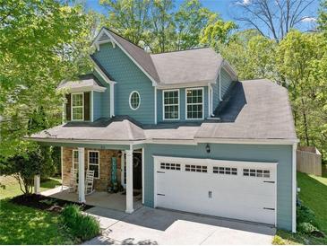 Charming two-story home with a covered porch and a two-car garage at 210 Cole Ct, Canton, GA 30114