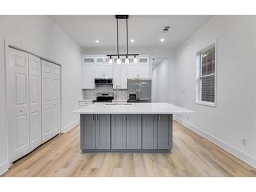 Bright kitchen features a large island, stainless steel appliances, and plenty of storage at 926 Welch Sw St, Atlanta, GA 30310