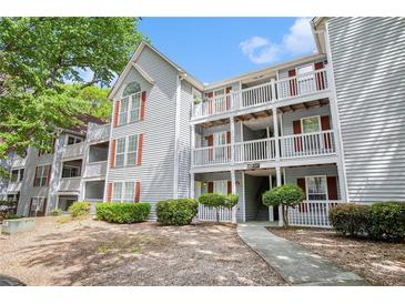 Charming condo building with well-maintained landscaping and exterior features at 233 Cobblestone Trl, Avondale Estates, GA 30002