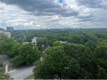 Expansive skyline views overlooking lush treescapes from a high vantage point at 145 15Th Ne St # 1015, Atlanta, GA 30309
