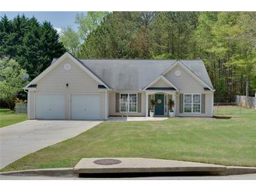 Charming one-story home featuring a well-manicured lawn and a two-car garage at 101 Javay Ct Ct, Villa Rica, GA 30180