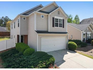 Charming two-story home with attached two-car garage and well-maintained landscaping at 507 Oakleaf Ct, Acworth, GA 30102