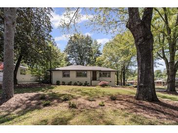 Charming single-story home featuring a well-maintained lawn and mature trees at 1089 Greenleaf Se Rd, Atlanta, GA 30316