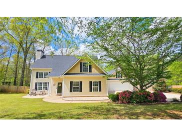 Charming two-story home with manicured lawn, a front patio, and traditional curb appeal at 156 Brookridge Ct, Douglasville, GA 30134