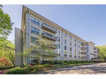 Elegant multi-story condo building featuring landscaped grounds, private balconies, and classic architectural details at 3203 Lenox Ne Rd # 32, Atlanta, GA 30324