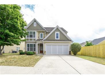 Charming two-story home with a three-car garage and well-manicured front yard at 2656 Staunton Ln, Duluth, GA 30096