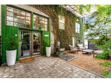 Beautiful front entrance with green accents, greenery, and an inviting outdoor seating area at 1570 Dekalb Ne Ave # F, Atlanta, GA 30307