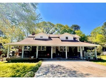 Charming one-story home with a sprawling front porch and inviting curb appeal at 2245 Panstone Sw Dr, Marietta, GA 30060