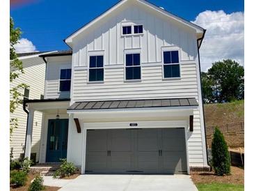 Charming two-story home with a gray attached garage and manicured lawn at 683 Summitt Hill Way, Cumming, GA 30040