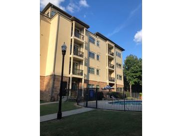 Attractive multi-story condo building featuring a community pool at 2230 Cheshire Bridge Rd # 412, Atlanta, GA 30324