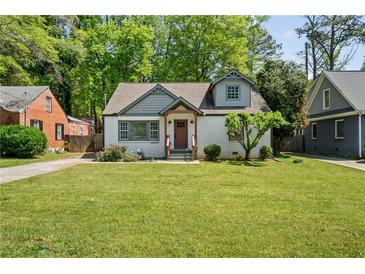 Charming bungalow home featuring a well-manicured lawn and inviting front porch at 1535 Deerwood Dr, Decatur, GA 30030