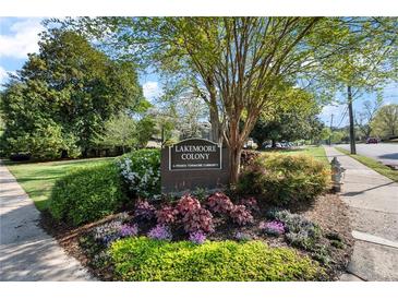 Well-maintained Lakemoore Colony sign surrounded by colorful landscaping and lush green trees at 270 Lakemoore Dr # B, Atlanta, GA 30342