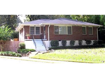 Charming brick home featuring a well-maintained lawn and inviting front entrance at 223 Lucerne St, Decatur, GA 30030