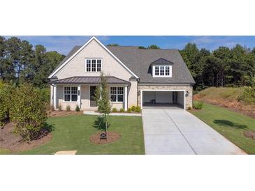 Charming single-Gathering home with a well-manicured lawn and a two-car garage in a quiet neighborhood at 5385 Keepsake Court, Cumming, GA 30040
