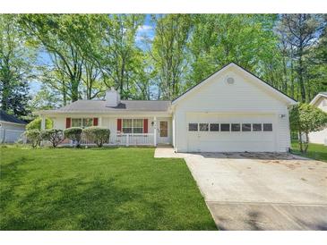Charming single-story home with a well-manicured lawn and attached two-car garage at 2139 Briar Glen Sw Ln, Atlanta, GA 30331
