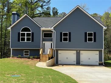 Charming two-story home with a two-car garage and manicured front lawn at 202 Gamel Rd, Dallas, GA 30157