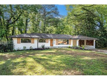 Charming renovated single-story home with modern updates, landscaping, and a welcoming front yard at 2685 Glenvalley Dr, Decatur, GA 30032