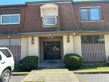 Apartment building entrance featuring double doors, building number and exterior lighting at 3038 Parc Lorraine, Lithonia, GA 30038