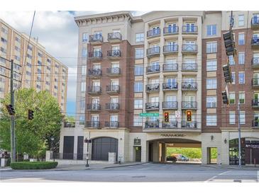 The Aramore building shows an elegant exterior with brick and stone details, balconies and covered drive-through at 2277 Peachtree Ne Rd # 310, Atlanta, GA 30309