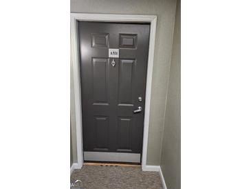 Condo front door with silver hardware and doorplate number A506 at 1075 Peachtree Ne Walk # 506, Atlanta, GA 30309