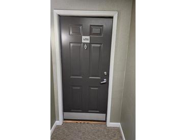Apartment front door showing unit A506 with white trim and neutral carpet at 1075 Peachtree Ne Walk # 506, Atlanta, GA 30309