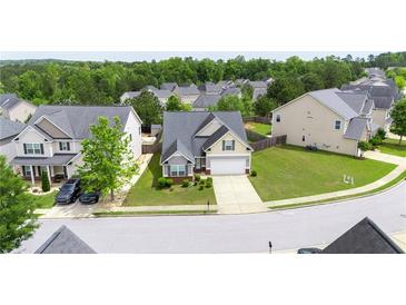 Charming single-Gathering home with manicured lawn, two-car garage, and lush green trees in a quiet neighborhood at 256 Bollen Ln, Hiram, GA 30141