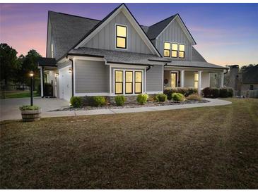 Charming two-story home with landscaped front yard, attached garage, and traditional architectural design at 220 Alcovy Reserve Way, Covington, GA 30014