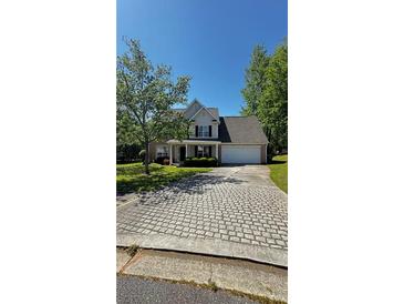 Charming two-story home with well-manicured lawn and attached two-car garage at 498 Haven Ridge Dr, Stockbridge, GA 30281