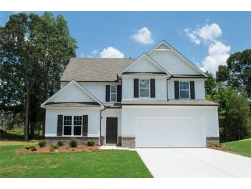 Charming two-story home with a manicured lawn, attached garage, and classic design at 233 Bloomfield Cir, Canton, GA 30114