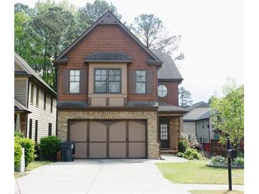 Charming two-story home with brick and shingle exterior, and a spacious two-car garage at 5122 Micaela Way, Duluth, GA 30096