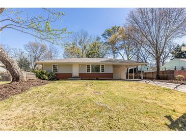Charming single-story home with a well-maintained front yard and attached carport at 43 Lott Se Ave, Marietta, GA 30067