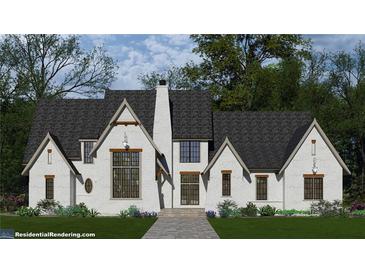 Charming white brick home featuring black frame windows and a lush green lawn at 6205 Bridgewood Dr, Buford, GA 30518