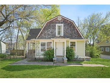 Charming two-story home with a shingle roof and a well-manicured lawn at 240 Lamon Se Ave, Atlanta, GA 30316