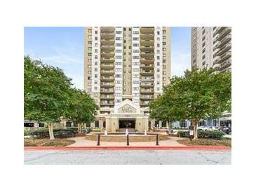 Stunning high-rise building featuring private balconies and a beautifully landscaped entrance with a fountain at 795 Hammond Dr # 806, Sandy Springs, GA 30328