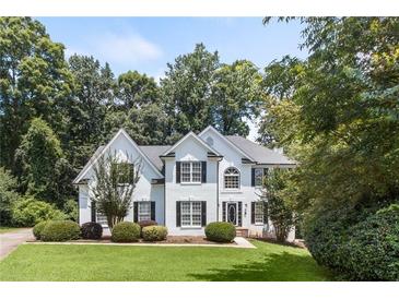 Charming white two-story home with black shutters and well-manicured landscaping at 3183 Robinwood Trl, Decatur, GA 30034