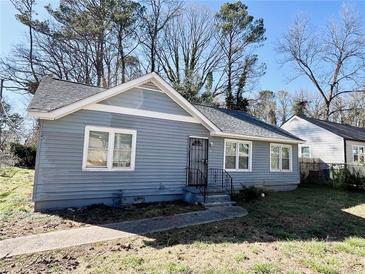 Charming single-story home featuring a well-maintained lawn, inviting entrance, and classic architectural details at 1703 Stanton Sw Rd, Atlanta, GA 30311