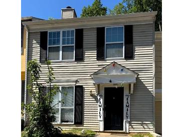 Two story home with cream colored siding and black shutters at 3082 Revere Ct, Atlanta, GA 30340