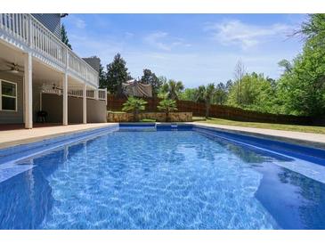 Backyard pool with in-ground pool and plenty of space for outdoor enjoyment at 526 Lost Creek Dr, Woodstock, GA 30188